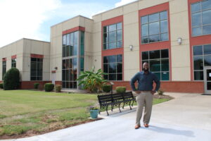 Deitrick Smart standing outside in front of the Bob Harrison Center.