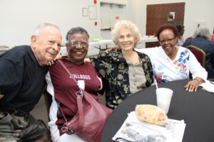 Four friends smiling at the Bob Harrison Center