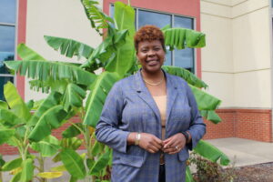 Alabama Madison County Commission District 6 Commissioner Violet Edwards stands in front of a banana leaf plant outside the Robert "Bob" Harrison Wellness and Advocacy Center in North Huntsville.